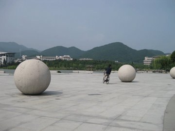 Here's Ryan biking around the giant stone balls that are in the front part of the campus. A lot of kids also roller skate in this area. 