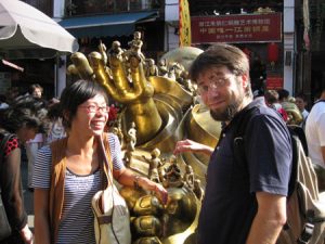 Ryan and our friend Sunshine touch a golden Buddha which is suppose to bring them good luck. 