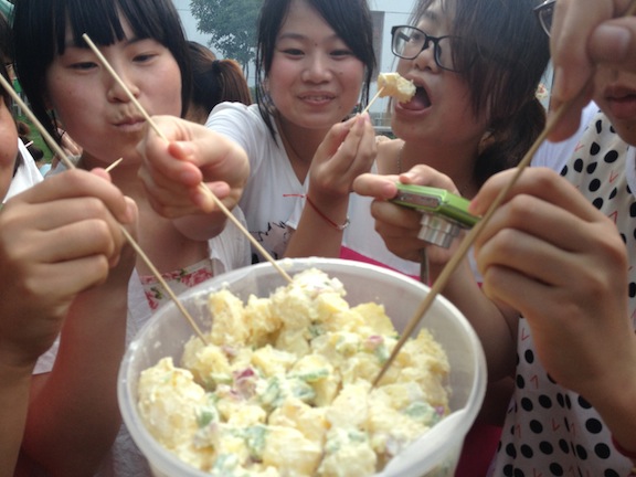 My darling students eating the potato salad I made. Yuuuum. 