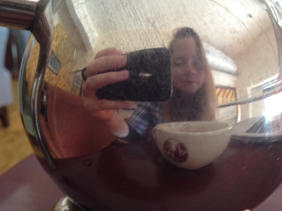 Sometimes even whike writing you need to take a beak, like the time I caught my stretched out reflection on the teapot. I took several selfies before getting back to work. 