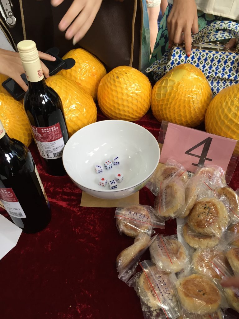 The prizes are often arranged at the bobing tables. Needless to say while I wanted to win the wine, I ended up winning a bunch of mooncakes instead. 