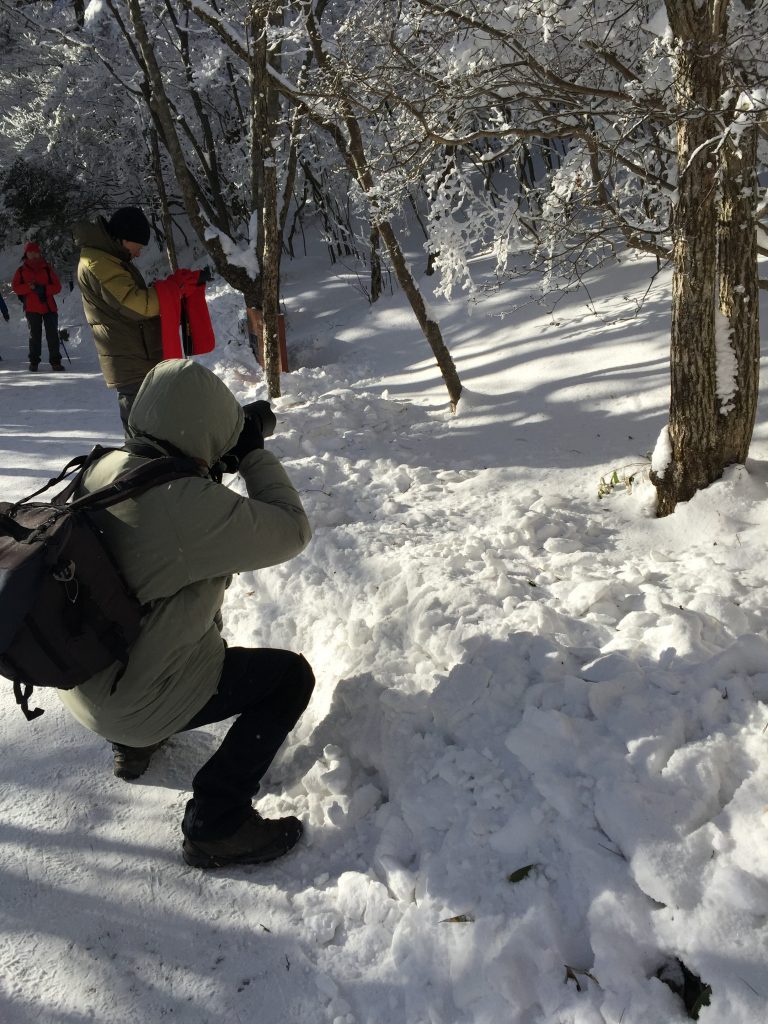 See that guy using $3000 equipment to take a picture of a reflection of a leaf on the snow? He's a good candidate to take a picture of you. 